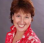 Smiling person in red and white shirt.