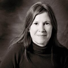 Black-and-white portrait of a woman with a calm expression.
