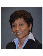 Professional woman smiling in a formal business portrait.