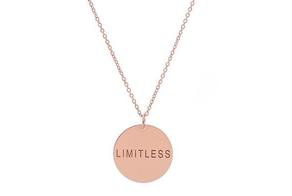 Rose gold necklace with a 'LIMITLESS' pendant.