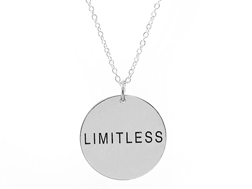 Silver pendant necklace engraved with the word LIMITLESS.