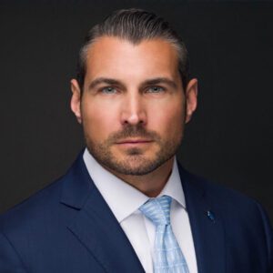 Man in suit with blue tie.