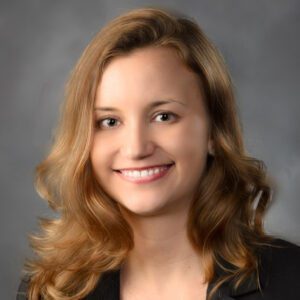 Smiling woman with wavy hair portrait.